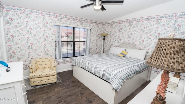 bedroom featuring dark hardwood / wood-style floors, ceiling fan, and lofted ceiling