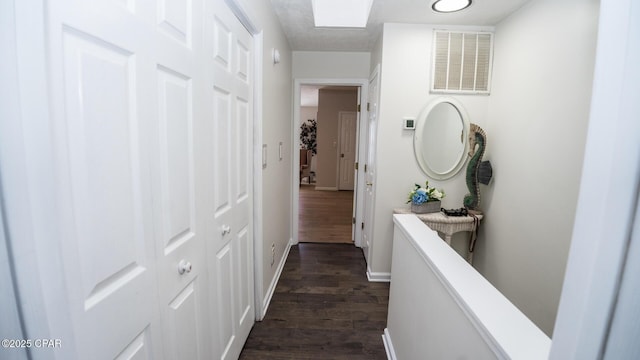 hall featuring dark wood-type flooring