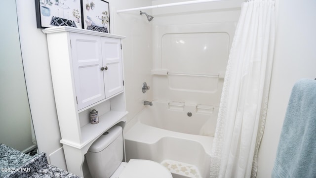 bathroom with toilet and shower / tub combo with curtain