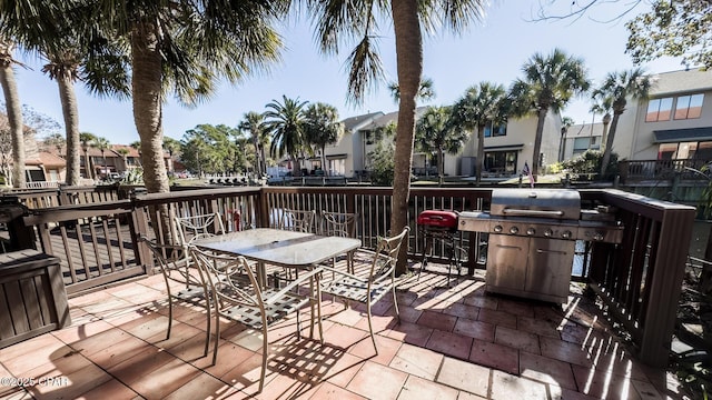 wooden deck featuring grilling area