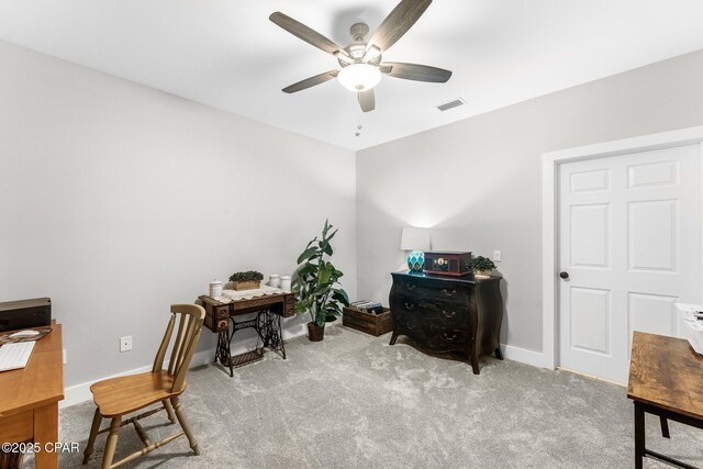 carpeted office with ceiling fan