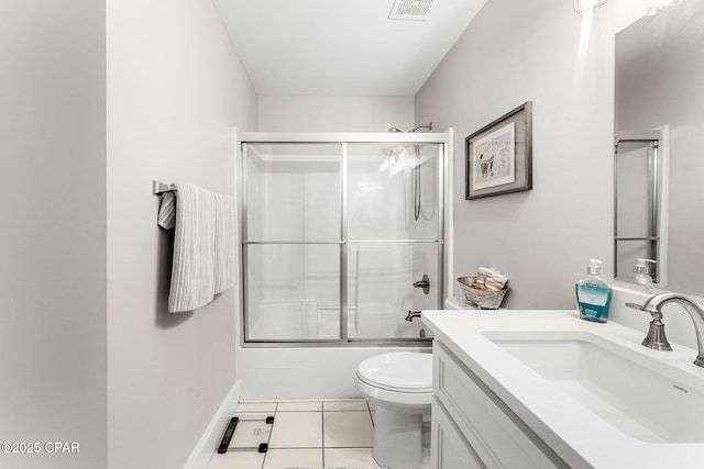 full bathroom featuring toilet, combined bath / shower with glass door, tile patterned floors, and vanity