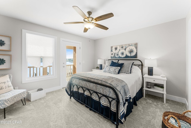 bedroom with ceiling fan, access to exterior, and carpet