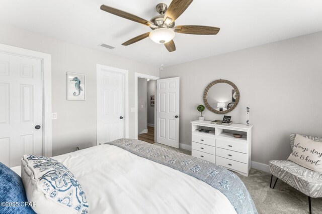 bedroom featuring ceiling fan and carpet