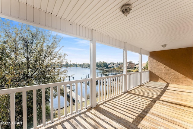 wooden terrace with a water view