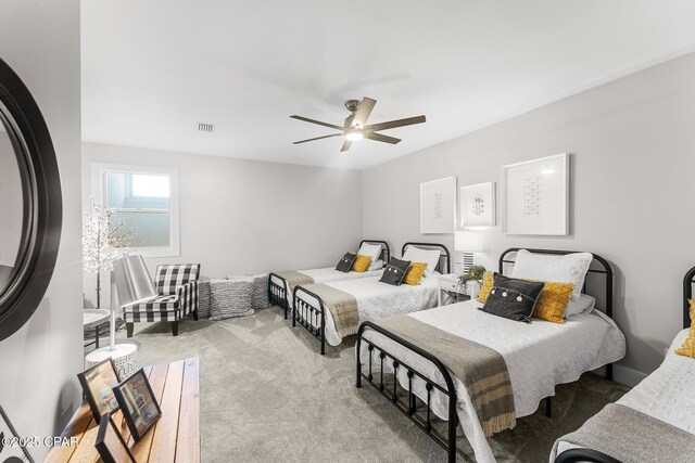 bedroom featuring ceiling fan and light carpet