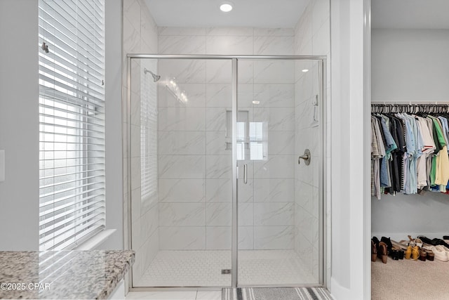 bathroom featuring plenty of natural light and an enclosed shower