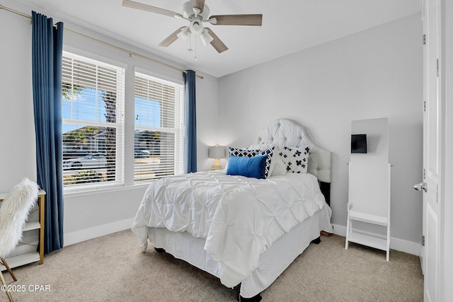 bedroom featuring ceiling fan and carpet