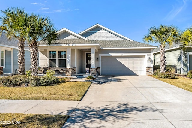 view of front of property with a garage and a front lawn