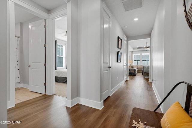 hall with wood-type flooring