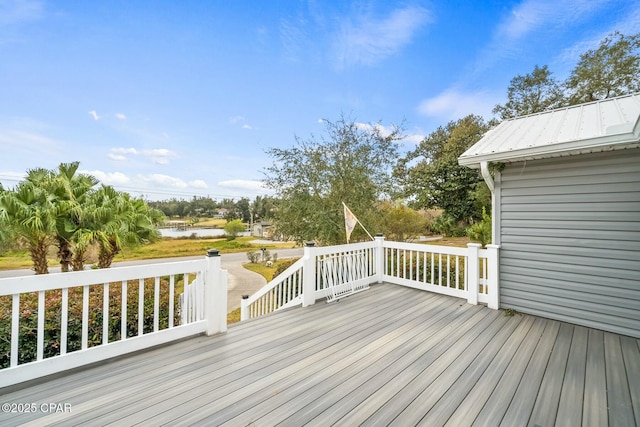 wooden deck featuring a water view