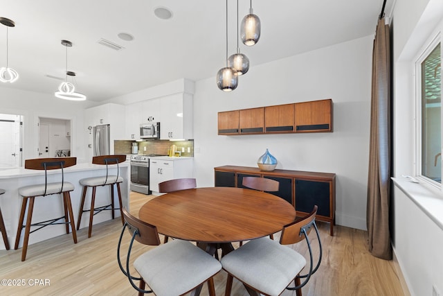 dining room featuring light hardwood / wood-style flooring