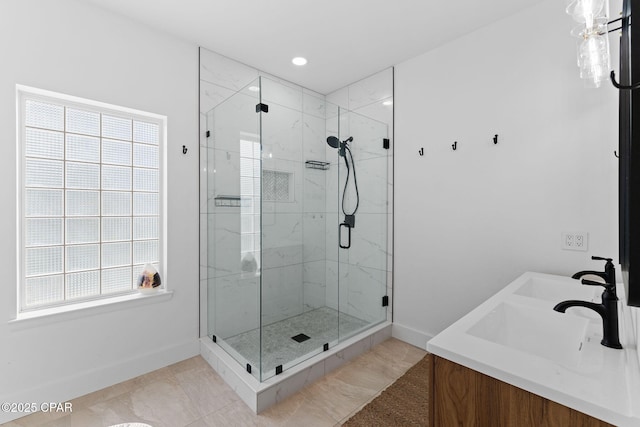 bathroom with tile patterned floors, a wealth of natural light, vanity, and an enclosed shower