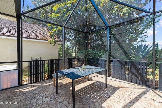 view of patio / terrace with a lanai