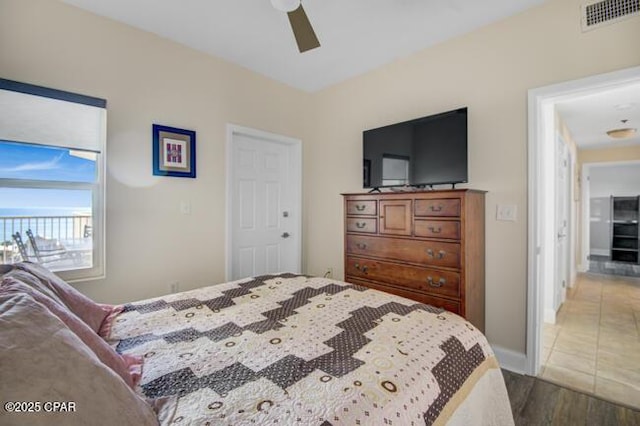 bedroom featuring ceiling fan and light hardwood / wood-style flooring