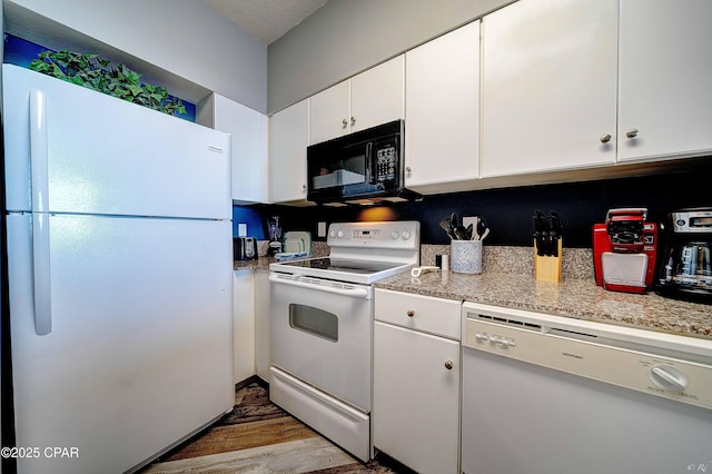 kitchen featuring wood-type flooring, white appliances, light stone countertops, and white cabinets