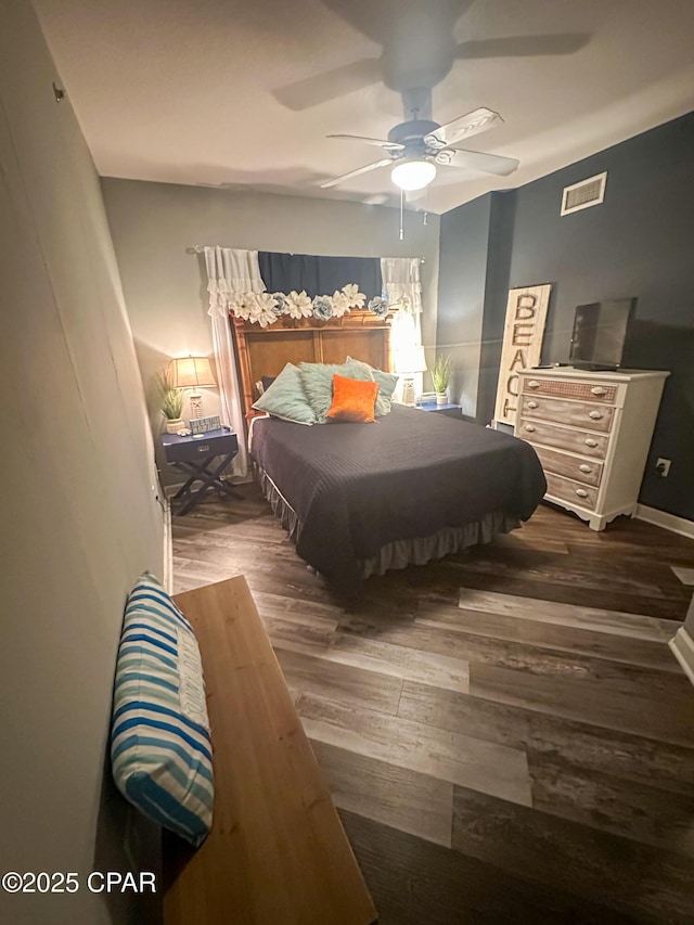 bedroom featuring dark wood-type flooring and ceiling fan