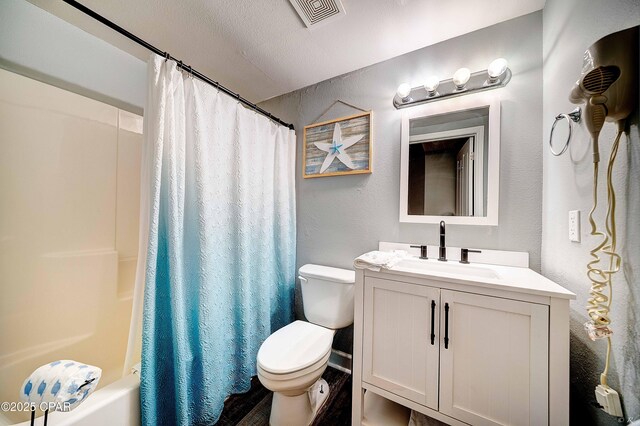 full bathroom with toilet, vanity, and shower / bathtub combination with curtain