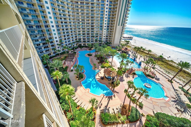 bird's eye view featuring a water view and a view of the beach