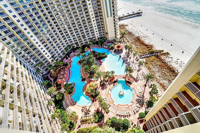 aerial view with a water view and a beach view