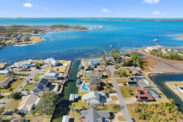 birds eye view of property with a residential view and a water view