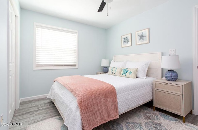 bedroom featuring ceiling fan and light hardwood / wood-style floors