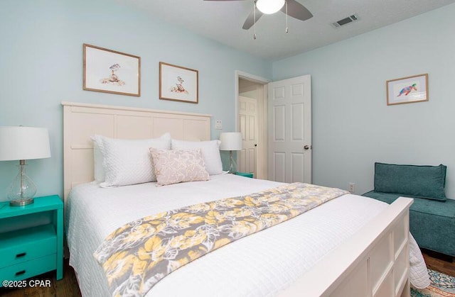 bedroom featuring ceiling fan and dark hardwood / wood-style flooring