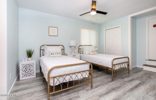 bedroom featuring a closet, ceiling fan, and hardwood / wood-style flooring