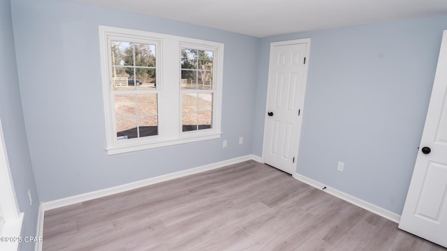 unfurnished room featuring light wood-type flooring