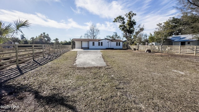 view of yard with a rural view