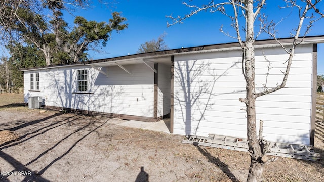 view of side of property with central AC