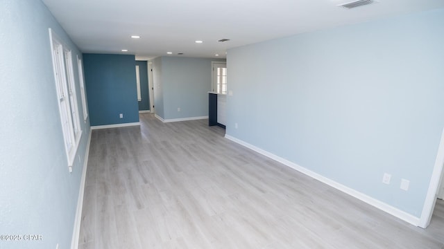 unfurnished room featuring light wood-type flooring