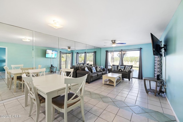 dining space featuring ceiling fan and light tile patterned floors