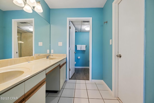 bathroom with vanity and tile patterned flooring