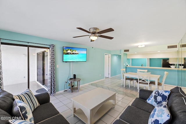 living room with ceiling fan, visible vents, baseboards, and tile patterned floors