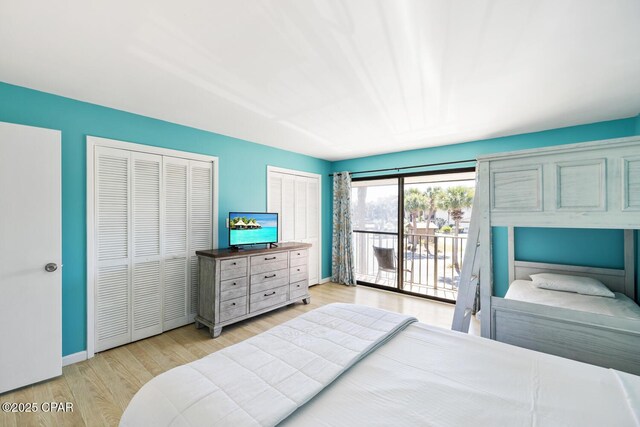 bedroom with access to outside and light wood-type flooring