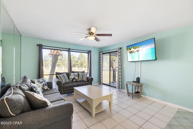 living room featuring ceiling fan and light tile patterned flooring