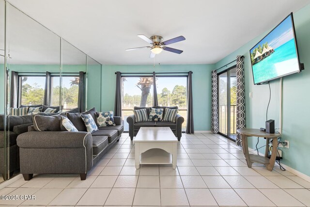 living room featuring ceiling fan and light tile patterned floors