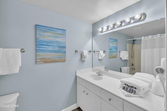 full bathroom with vanity, toilet, and shower / bath combo with shower curtain