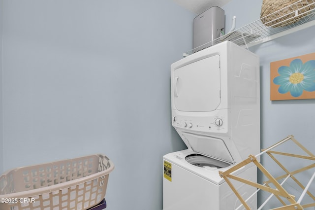 laundry room featuring stacked washer and clothes dryer