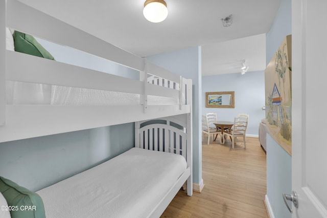 bedroom with light wood-type flooring