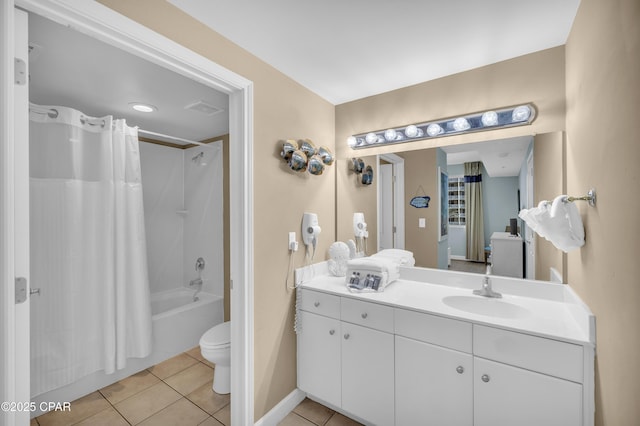 full bathroom featuring vanity, shower / bath combination with curtain, tile patterned floors, and toilet