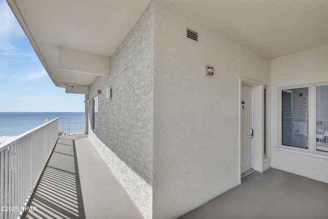 balcony featuring a water view