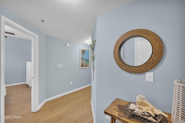 hall with light hardwood / wood-style floors