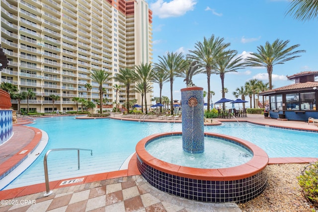 view of swimming pool featuring pool water feature