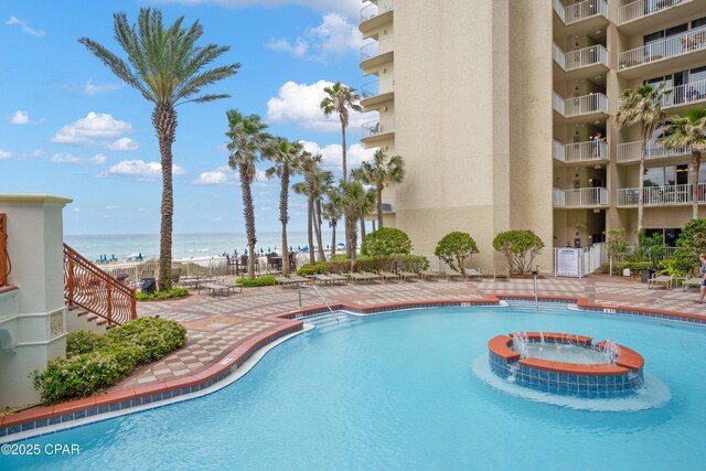 view of pool with a water view