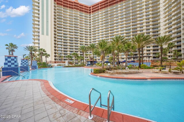 view of swimming pool featuring a patio area