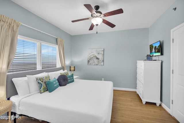 bedroom with ceiling fan and light hardwood / wood-style flooring