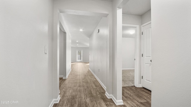 corridor featuring hardwood / wood-style floors