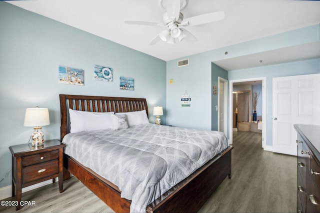 bedroom with hardwood / wood-style floors and ceiling fan